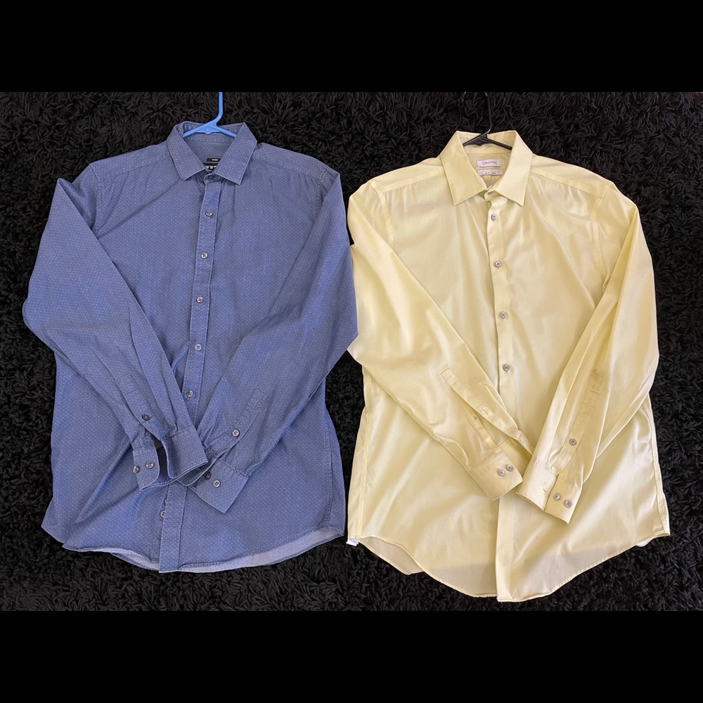 Pair of long sleeve button up dress shirts